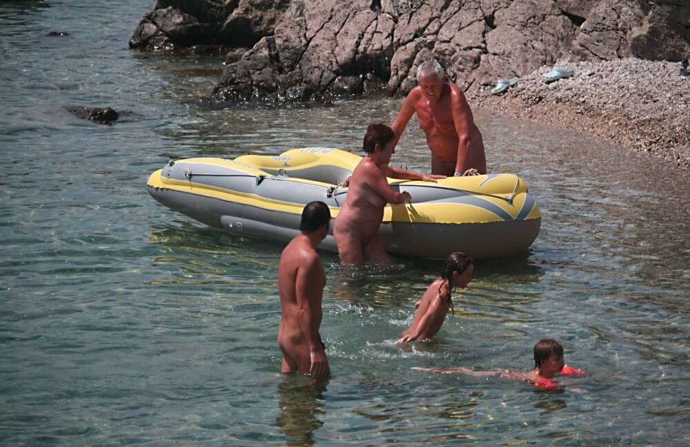 Lone Nudist in Yellow Boat photos - Nudity helps you feel free