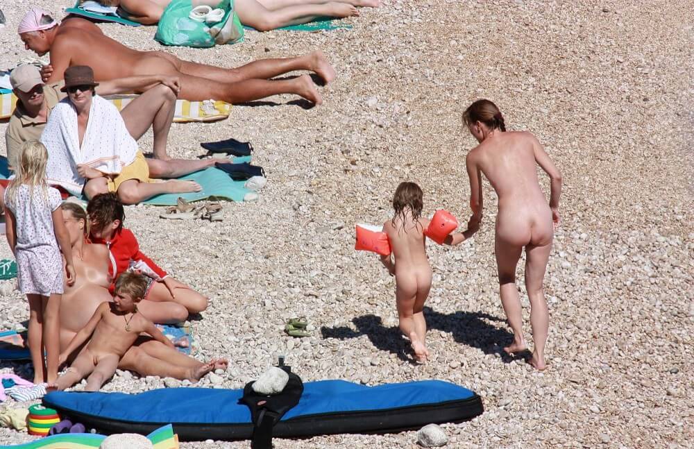Orange Floaty Safety First Naturist pics - The practice of nudism helps overcome insecurities and overcome fears